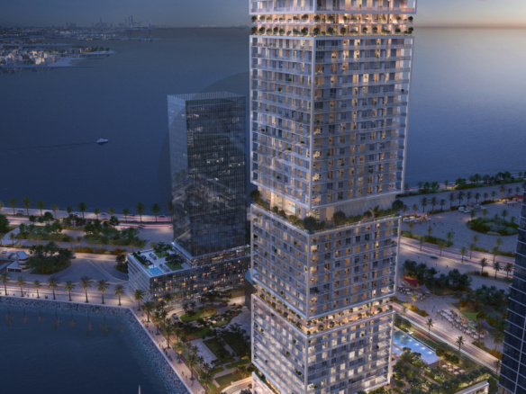 Saria by Beyond - aerial dusk view of the tower beside the water